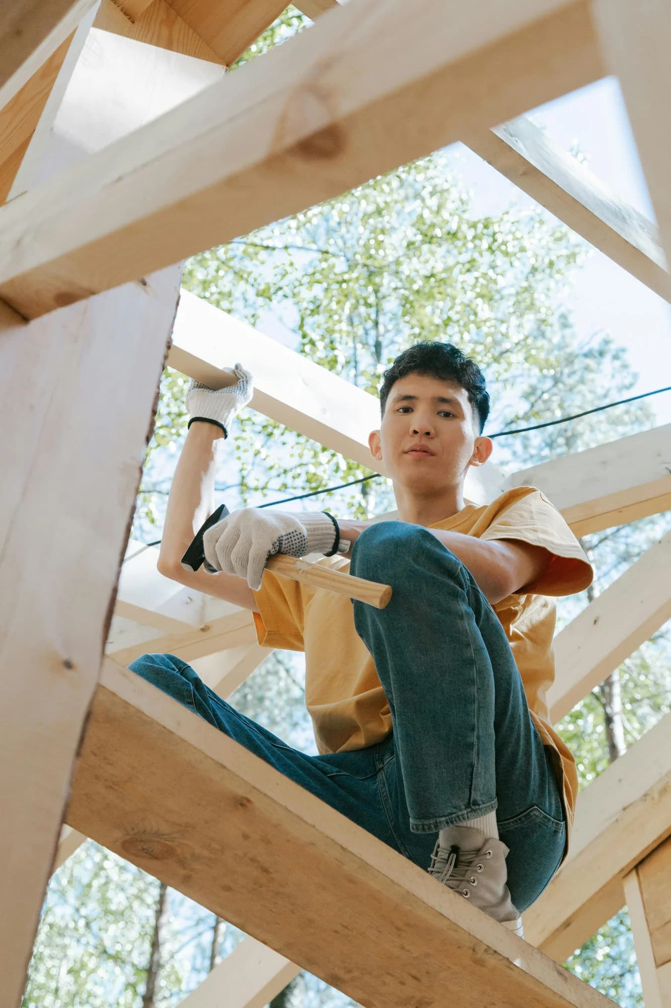 A Pathfinder student building with wood framing